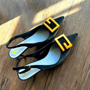 Black sling back designer shoes. Size is off. Fits like a 9.